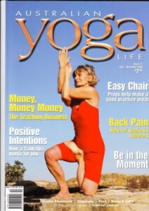 Magazine cover image of eve in a kneeling yoga pose.