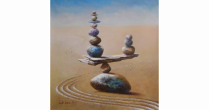 Image of stones balancing on a rock, from big to little