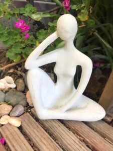 In an article about living legacy, a yoga statue in a pose is represented